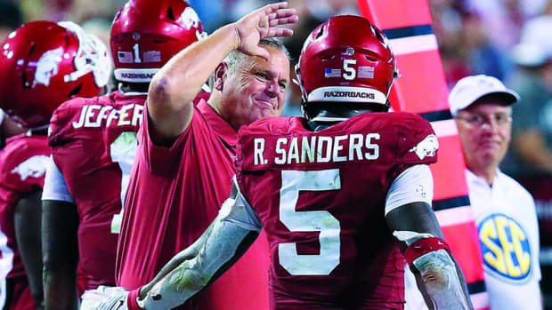 Arkansas Razorbacks coach Sam Pittman celebrates with running back Raheim Sanders (5) after a score against the Missouri State Bears in the fourth quarter at Razorback Stadium. Arkansas won 38-27.